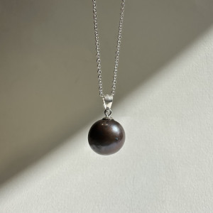 Pendant with natural pearl on a silver chain